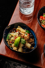 fried Chinese rice with squid, vegetables and herbs. restaurant 