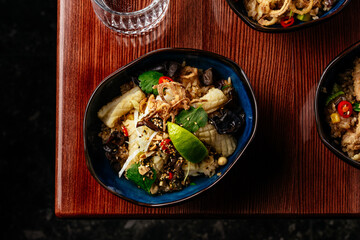 fried Chinese rice with squid, vegetables and herbs. restaurant