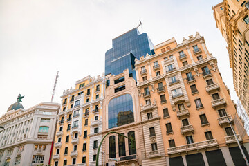 Historic old buildings in the shopping street Gran Via in Madrid
