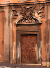 Via delle Quattro Fontane Street Former Church Facade Close Up with Wooden Entrance and Sculpted Details in Rome, Italy