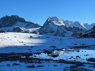 Alpine rocky mountain peaks Piz Vadret (3229 m) and Piz Grialetsch (3130 m) in the massif of the Albula Alps above the Vardet da Grialetsch glacier, Zernez - Canton of Grisons, Switzerland (Schweiz)