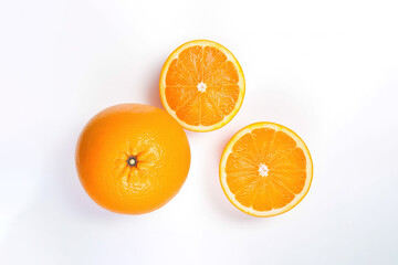 Fototapeta premium Top view of fresh whole and sliced oranges isolated on white background. Created with Generative AI Technology