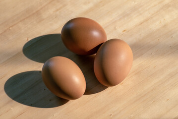 brown eggs on wooden table