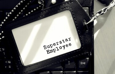 worker staff id card with text written Superstar Employee on white background. concept of excellent...