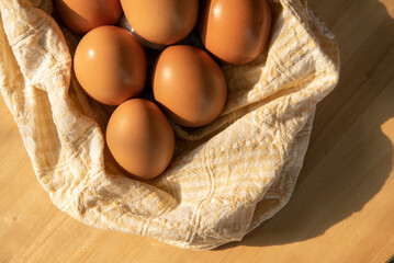 brown eggs on wooden table