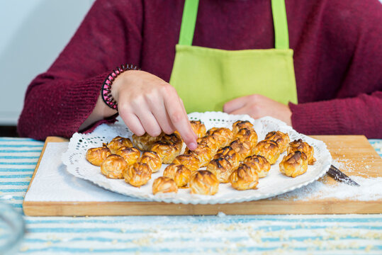 Girl showing you a sort of catalonian homemade pastry called Pan