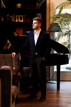 young stylish european man in a suit before a business meeting
