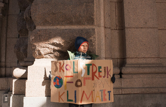 boy striking for climate change in Stockholm.
