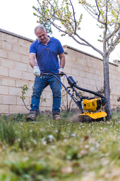 stock photo of man working in the garden