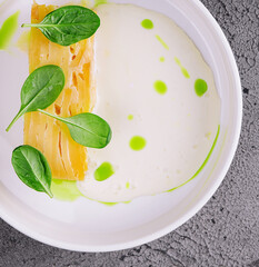 potato gratin in creamy basil sauce