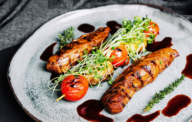Tasty baked pork tenderloin with grilled vegetables