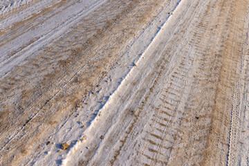 A road covered with snow and ice for cars