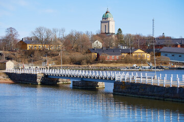Suomenlinna Church, old bridge, old military buildings on island near Helsinki city, capital of...