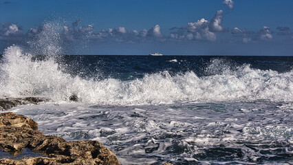 waves breaking on the rocks