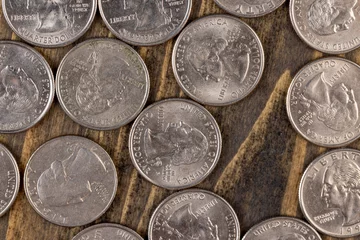 Fotobehang old American quarter dollar coins, close-up © rsooll