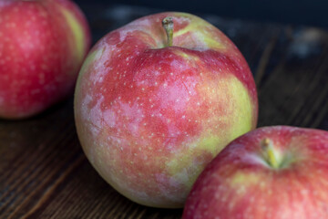 Fresh red and green apples on the kitchen table