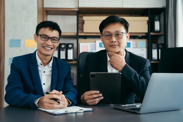 Business team meeting present.professional investor working with new startup project. Finance managers task.Digital tablet laptop computer design in morning light.