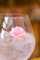 Fresh lemonade cocktail with crushed ice,   and divers oranges. Summer cold drink. Flutes of pink rose champagne garnished with red raspberries and green thyme make for a festive cocktail gathering.