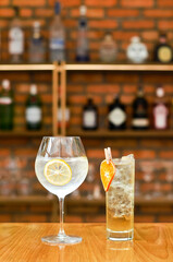 Refreshing summer mocktails  lemonade cocktail with crushed ice,   and divers oranges. Summer cold drink concept in luxury bar