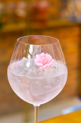 Fresh lemonade cocktail with crushed ice,   and divers oranges. Summer cold drink. Flutes of pink rose champagne garnished with red raspberries and green thyme make for a festive cocktail gathering.