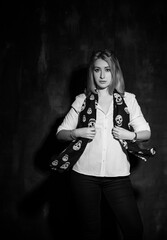 Woman in white shirt and scarf with a skull, fashionable trend for young people, new collection