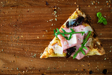 Pinsa Romana with mortadella, parmesan cheese and vegetables on wooden table  © Jacek Chabraszewski