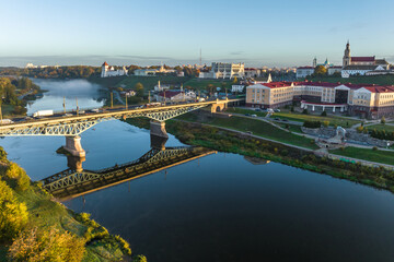 Fototapeta na wymiar aerial view from great height on wide river and huge bridge of old city