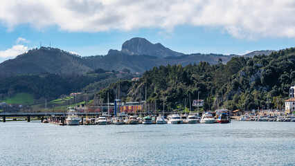 Puerto Maritimo at the foot of the high mountains of Asturias in the picturesque village of Ribadesella, Spain.