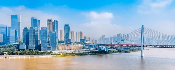 Gordijnen City skyline scenery with tall buildings and Dongshuimen Bridge in Chongqing, China © Govan