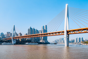 City skyline scenery with tall buildings and Dongshuimen Bridge in Chongqing, China