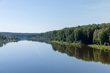 Wide river in summer in sunny weather