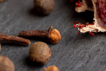 Different types of spices and nutmeg on the board