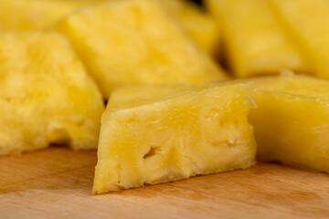 ripe yellow pineapple cut into pieces
