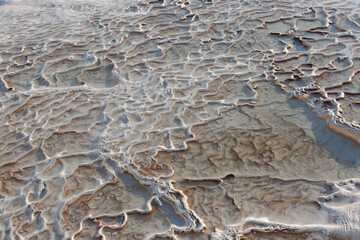 Terraces in Pamukkale. The texture of a carbonate mineral. Natural pools in Turkey