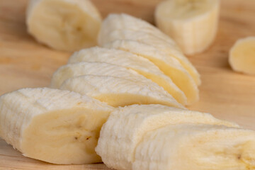 a ripe sweet banana cut into pieces lies on the table