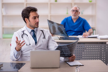 Two male doctors radiologists working in the clinic