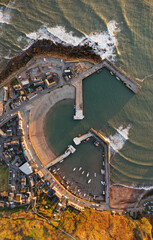 Stonehaven harbour and town at sunrise during the summer