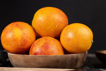 yellow-red orange peel covered with water drops