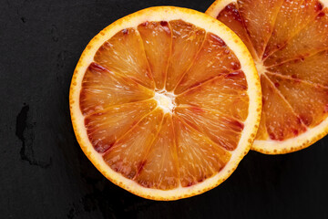 the red-orange flesh of an orange sliced in close-up