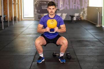 Fitness, Kettlebell And Personal Trainer In The Gym For Health. Exercise, Workout And Bodybuilder...