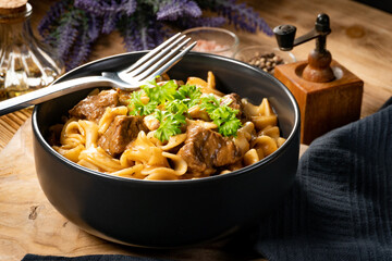 Tagliatelle mosse with beef sauce.