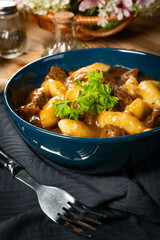 Beef stew in gravy.