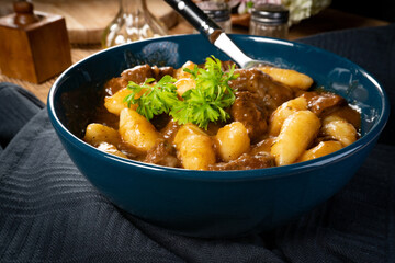 Beef stew in gravy.