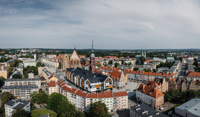 Fototapeta na wymiar Nysa, aerial panoramic view of Nysa downtown, the main square, Town hall tower and Basilica of St. James and St. Agnes. Drone view of the oldest towns in Silesia.
