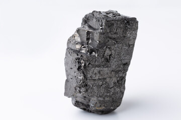 Natural black fossil coal on a white isolated background.