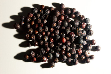 Juniper seeds on white background