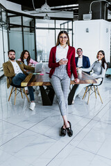 young latin businesswoman portrait working with teamwork on background at office in Mexico, hispanic people