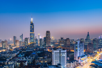 Fototapeta na wymiar Night view of Zifeng building and city skyline in Nanjing, Jiangsu, China