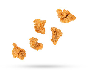Fried popcorn chicken falling in the air isolated on transparent background. PNG