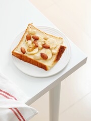 Top view of a Peanut Butter Banana Toast on white table